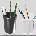 Black and white pencil holders with various colorful pens and pencils