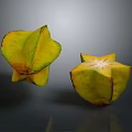 Star Shaped Carambola Fruits With Yellow Red Edges Whole And Sliced On Dark Background