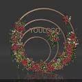 Elegant Circular Floral Installation with Golden Frame Red Flowers Green Foliage and Decorative Design
