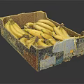 Fresh Ripe Bananas in an Open Cardboard Box with Torn Edges and Stickers