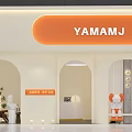 YAMAMJ Storefront Exterior With Arched Doorways Orange Signage And Decorative Elements
