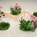 Curved Orange Checkered Art Installation With Green Plants And Pink Flamingos