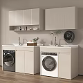 Black and White Washing Machines in Laundry Room with Light Colored Cabinets and Countertop