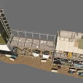 Industrial Tower with Metal Frame Platform and Storage Tank Surrounded by Equipment and Stacked Items