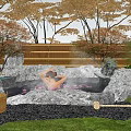 Serene Courtyard Garden With Natural Hot Spring Rocks Lush Trees Greenery And Relaxing Bathing Area
