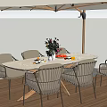 Oval Outdoor Table with Wicker Chairs and Beige Umbrella on Wooden Patio with Flower Vase