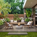 Tranquil Courtyard Garden With Outdoor Sofa Chairs Fire Pit Wooden Fence and Lush Greenery