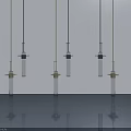 Three Modern Chandeliers With Blue Accents And Glass Tubes Hanging In Interior Space