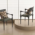 Black Armchair With Leopard Print Cushion And Armrest By Window Blinds On Round Platform