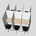 Multiple Office Desks In Cubicles With Light Wood Surface And Black Chairs