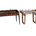 Two Stylish Foosball Tables With Black Metal And Wooden Legs For Recreational Use