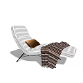 White Lounge Chair With Brown Cushion And Striped Blanket On Black Frame