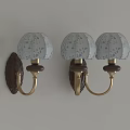 Elegant Three Wall Lamps With White Floral Shades Dark Bases And Brass Arms On Wall