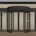 Modern Revolving Door With Metal Frame Glass Panels And Fixed Glass Doors In Indoor Setting