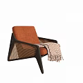 Stylish Orange Single Seater Armchair With Black Frame And Plaid Blanket