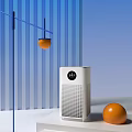 White Air Purifier With Digital Display In Modern Space With Blue Stripes And Orange Balls