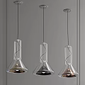 Three Modern Transparent Glass Conical Pendant Lights With Metallic Finishes