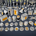 Industrial Equipment Parts in Gray with Orange Details Including Hoists Lights and Wheels