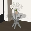 Modern Glass Top Side Table With Metal Cross Base And White Flower Vase