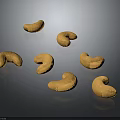 Golden Brown Whole Cashew Nuts on Dark Shiny Surface with Natural Texture