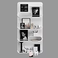 Stylish White Wall Mounted Shelving Unit With Decorative Frames Mugs And Books