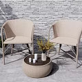Beige Rattan Outdoor Patio Chairs And Round Table With Stone Wall Background