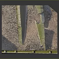 Textured Natural Rock Structure With Brown Surface And Green Mossy Base