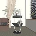 Black Two Tiered Side Table With Metal Frame Round Base And Magazine On Lower Shelf