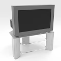 Gray Television Set Placed On Silver Glass Shelf TV Stand