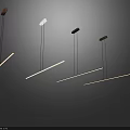 Modern Linear Pendant Lights Hanging In Dark Room With Warm Glow