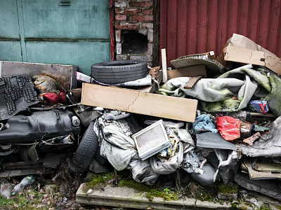 Waste Pile with Tire Wooden Board Fabric Old Electronics Cardboard Boxes and Red Brick Wall 3d model