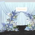 Elegant Photo Spot With Light Blue Arch Curtains And Blue White Floral Decorations