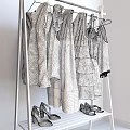White Clothes Rack with Hanging Polka Dot Pink Green White Dresses Blouses and Shoes