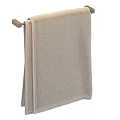 Soft Beige Textured Towel Hanging On Wall Mounted Towel Rack For Bathroom