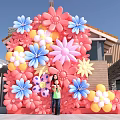 Vibrant Floral Art Installation With Pink Blue Yellow Flowers Outdoor Family Posing In Front