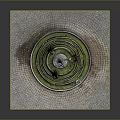 Scenic Landscape Showcasing Circular Fountain With Green Moss Metal Spire And Stone Pavement