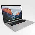 Sleek Silver Laptop Displaying Scenic Mountain Wallpaper And Modern Design
