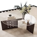 Modern Glass Top Coffee Table With White Flowers Books And Candle Holders On Carpet