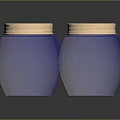 Two Carved Blue Glass Jars With Gold Lids And Intricate Sculpted Patterns