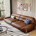 Cozy Living Room With Brown Leather Sofa White Blue Cushions Round Glass Coffee Table Wall Art