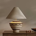 Ceramic Table Lamp With Beige Fabric Shade And Brown Geometric Patterns On Wooden Table