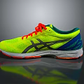 Bright Yellow ASICS Running Shoes With Orange Laces And Blue Accents For Sports