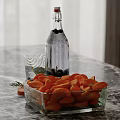Clear Glass Bottle Black Berries And Orange Carrot Slices Decorative Ornaments Set On Marble Tabletop