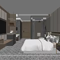 Modern Hotel Guest Room With Large Bed Flat Screen TV And Patterned Carpet