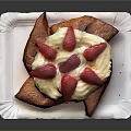 Fried Pastry With Cream Filling And Fresh Strawberries On Paper Plate