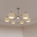 Modern Ceiling Chandelier With Multiple White Globe Shades Illuminating Room Corner 3d model