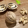 Whole and Shelled Walnuts with Fresh Mint Leaf on Wooden Surface 3d model