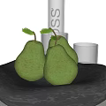 Three Fresh Green Pears Arranged In Black Bowl With Transparent Glass In Kitchen Setting