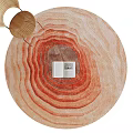 Round Rug With Orange Red Wavy Texture And Open Book On Top