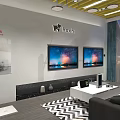 Modern Showroom Interior With White Tables TV Screens Sofa And Yellow Ceiling